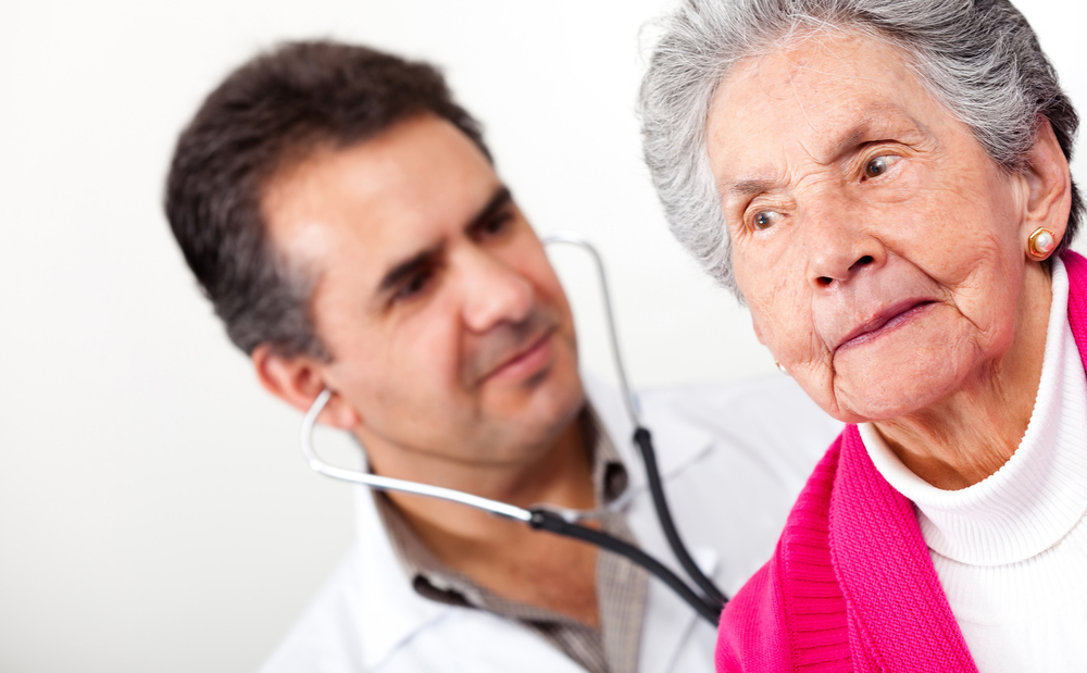 Elderly woman in a nursing home with a male doctor. Medical malpractice concept